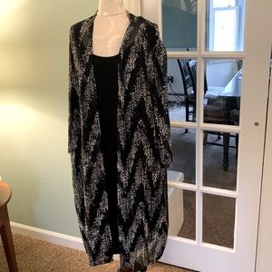Black dress with attached black and white jacket